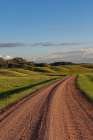 Gravel Road along the Powder River in the Custer National Forest, Montana, USA. Art Print